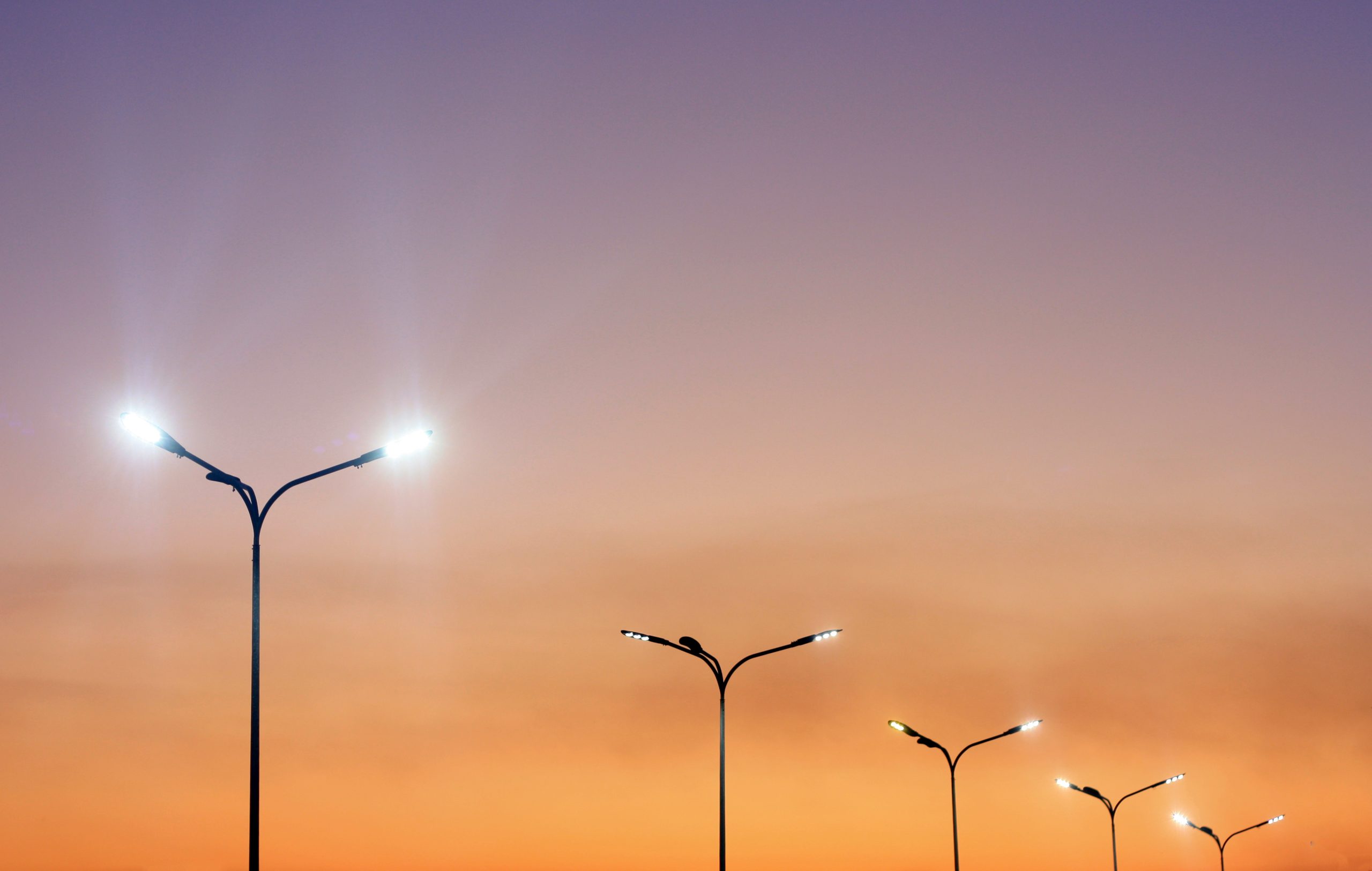 Urban landscape with modern minimal street lights and vibrant sky